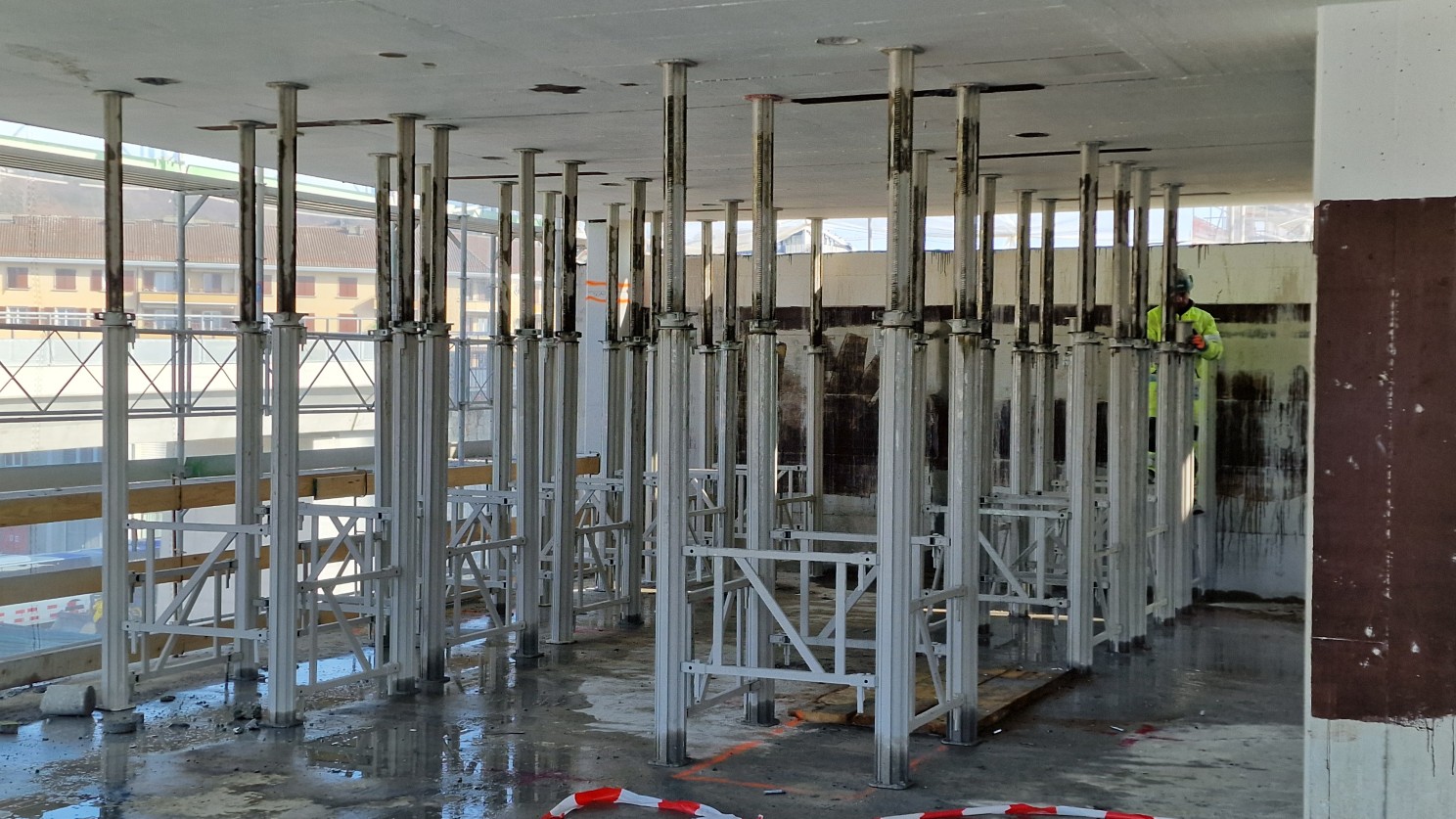 Temporary props support the slab before elements are separated.