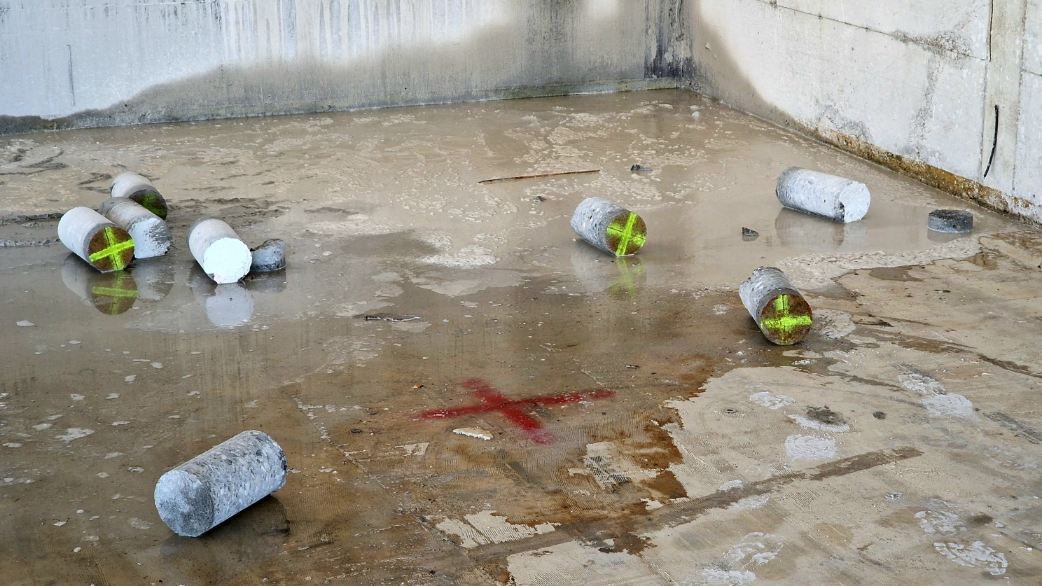Concrete cores extracted for material testing.