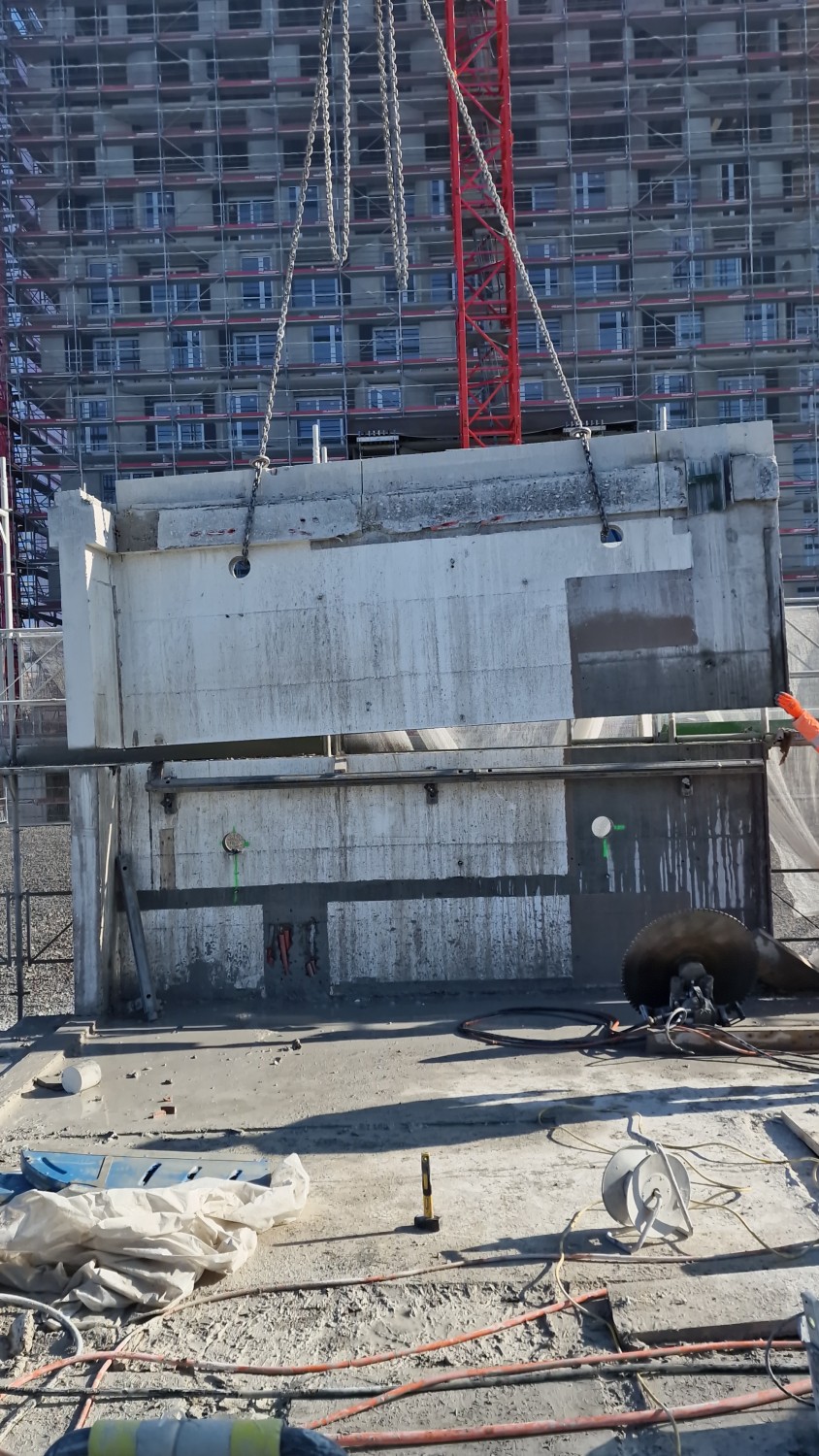 The crane supports the element as it is separated.